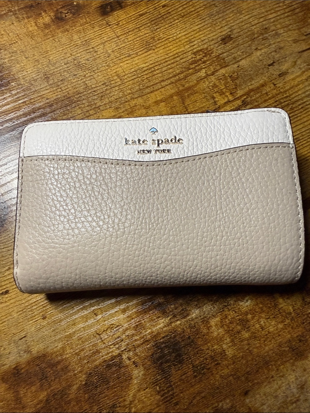 kate spade Pebbled Leather Bifold Wallet in Beige and White